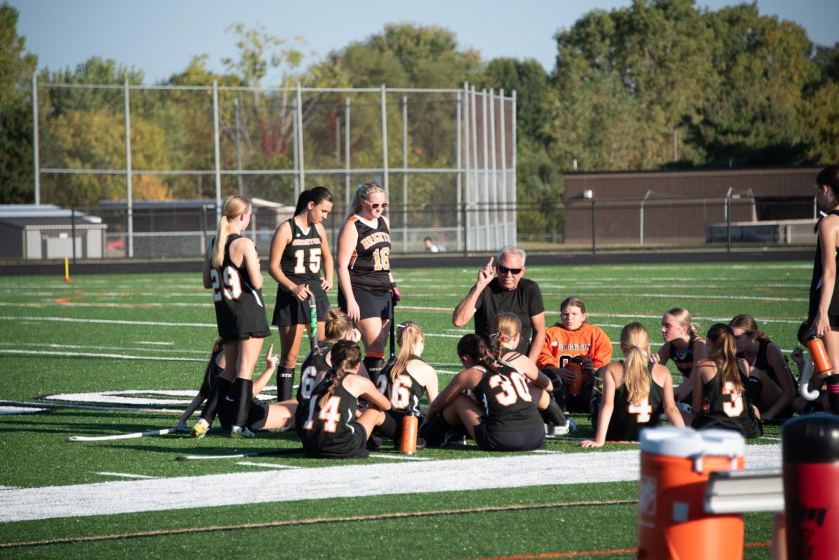 The Brighton High School JV girls field hockey team convenes after a game.