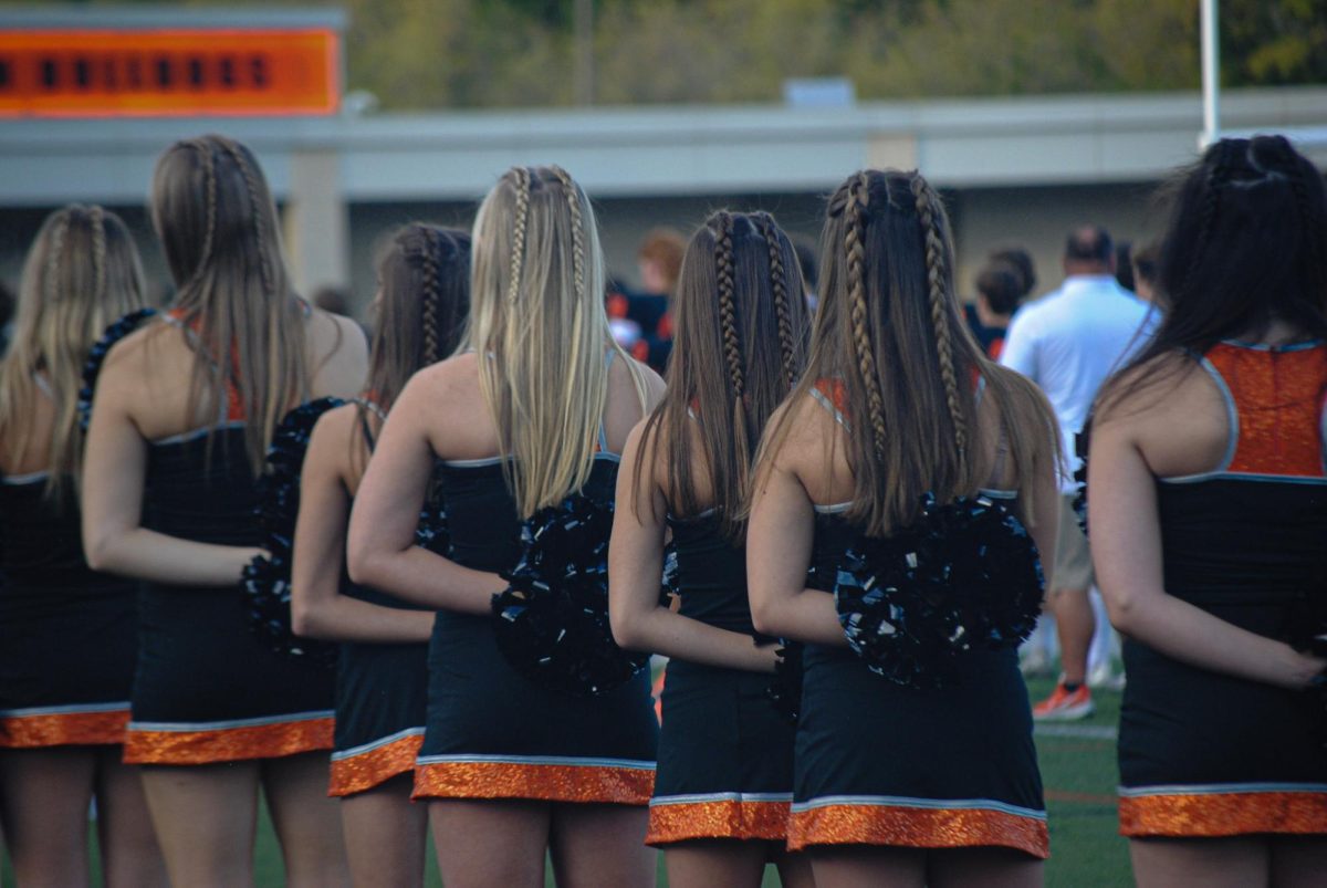 Brighton High School's junior varsity pom team performs at the junior varsity football game against Plymouth High School on Oct. 2, 2025.