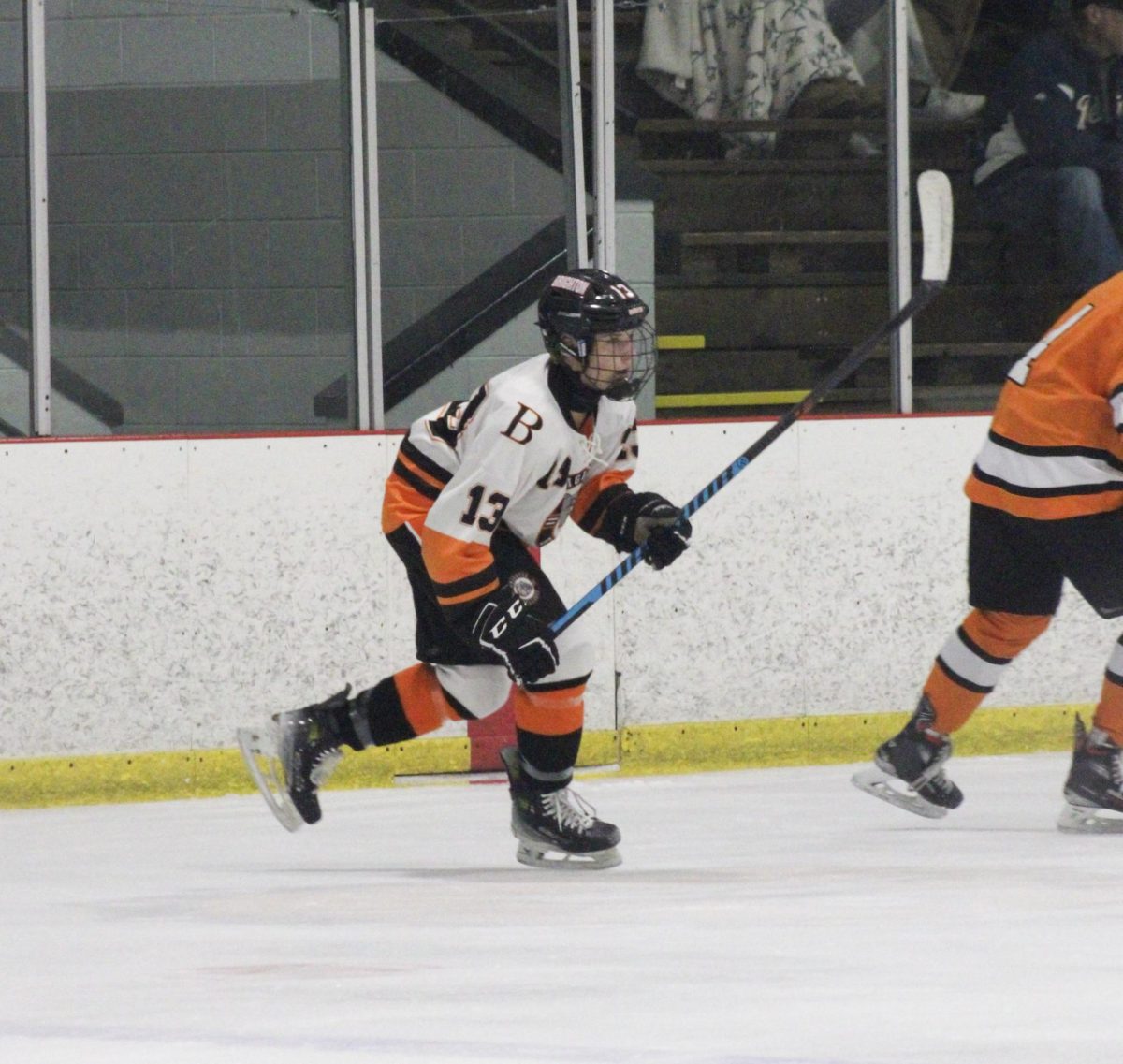 Sophomore and forward John Orton skates across the ice.