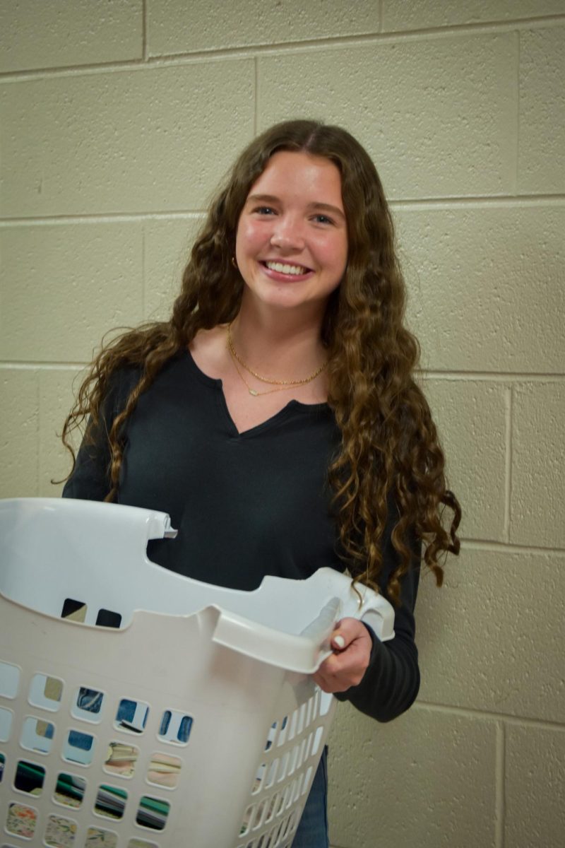 Sophomore Nora O'Malley trades her backpack for a laundry basket on "Anything But a Backpack Day."