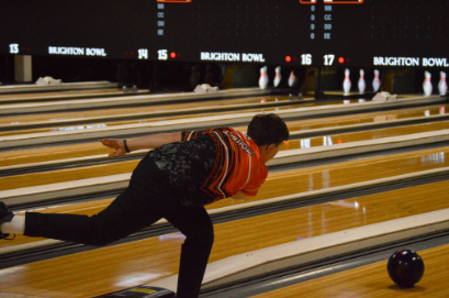 Freshman Hudson Laurie, a member of the junior varsity team, tosses a bowling ball down the lane.
