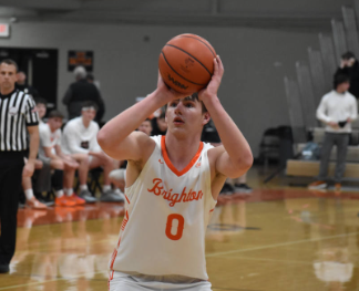 Senior Dylan Edgeworth attempts to shoot a basket against Northville at a game on Jan. 6, 2026. Brighton was ultimately able to emerge victorious, securing a score of 50-36.
