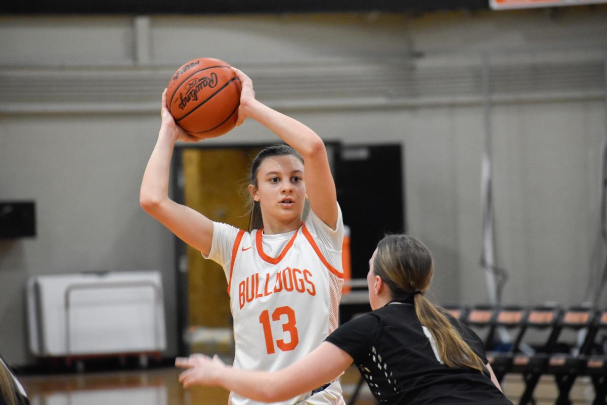 Freshman Vivian Wright looks for a passing opportunity to a teammate while being guarded by a Plymouth player in a game on Jan. 13, 2026.
