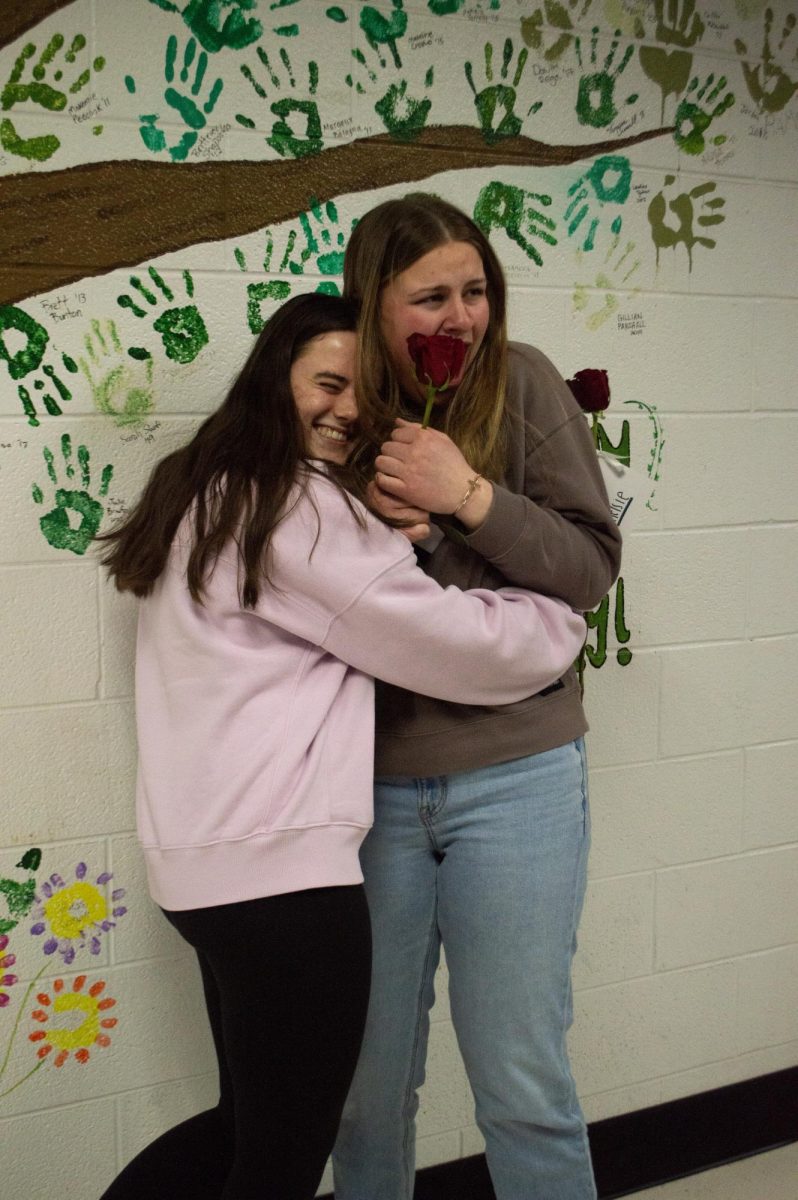 Team Blue members Ella Sata and Kelsey Croucher celebrate after being selected for Senior Survivor in February.